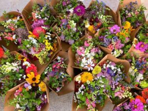 Colorful fresh flowers wrapped in kraft paper
