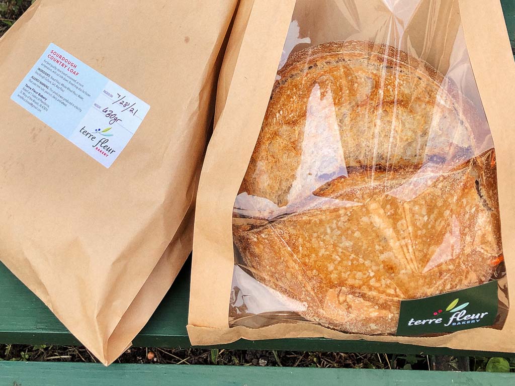 Sourdough in kraft bags with packaging labels affixed.