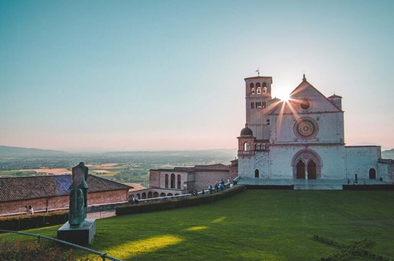The sun peeking out from behind the chapel at Assisi.