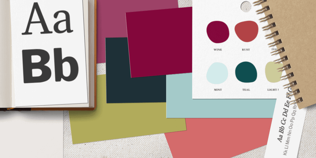 Color swatches and typography sample lying on a table.