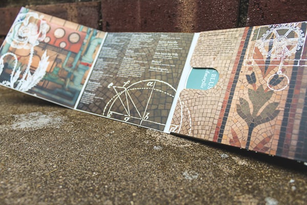 Interior panels of an album's eco-wallet, showing track information and non-song copy.