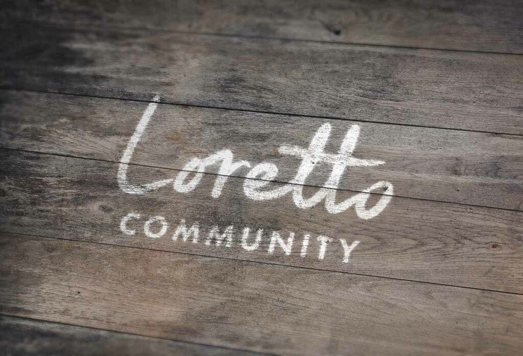 Loretto logo printed on wood